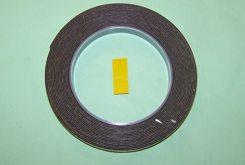 Double-Sided Adhesive Foam Tape - Yellow Backing.  Designed for automotive trim fixing.  Delayed cure allows for repositioning where required. 12mm x 5m