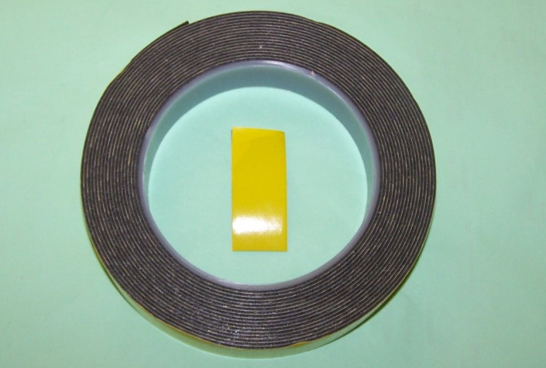 Double-Sided Adhesive Foam Tape - Yellow Backing.  Designed for automotive trim fixing.  Delayed cure allows for repositioning where required.  19mm x 5m.