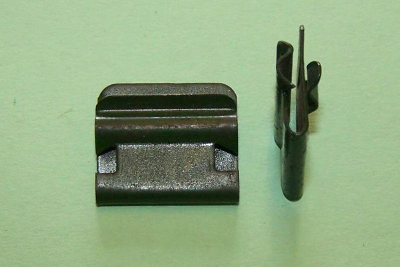 Weatherstrip clip, green in colour (now phosphate black). Early Fords.